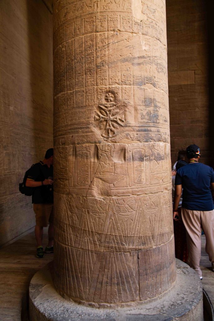 A cross carved into a column.