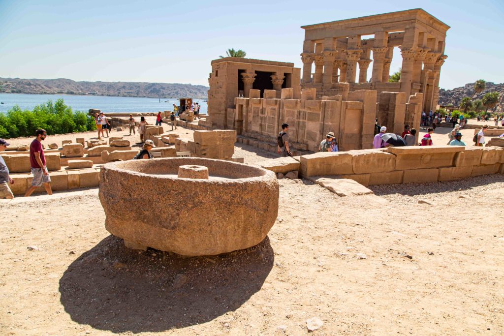 A grind stone and the Kiosk of Trajan.